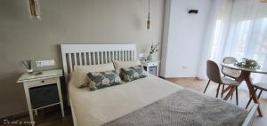 Postel nebo postele na pokoji v ubytování Elegante estudio frente a la playa