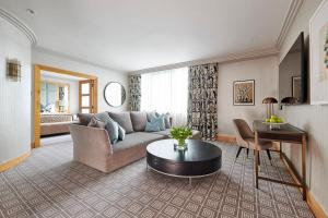 a living room with a couch and a table at The Westbury Hotel in Dublin