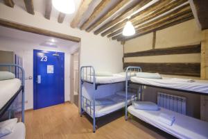 Postel nebo postele na pokoji v ubytování El Albergue de la Catedral
