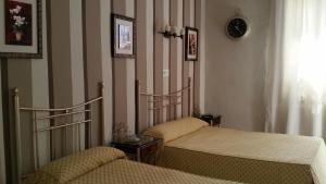 Voodi või voodid majutusasutuse Hostal Almanzor toas