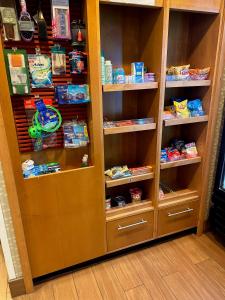 a wooden book shelf filled with lots of food at King's Inn Mason,Ohio in Cincinnati