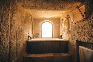 a bathroom with a bath tub and a window at Wonder of cappadocia in Göreme