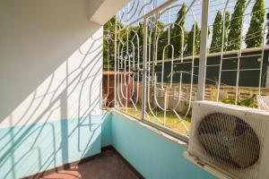 a room with a window with a air conditioner at 3 bedroom Apartment in Dar es Salaam