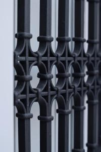 a black iron fence with spikes on it at Aidos Villa Santorini in Megalokhori