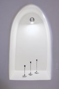 a shelf in a bathroom with four wine glasses at Aidos Villa Santorini in Megalokhori