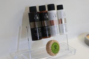 a group of four bottles of soap and a cork at Aidos Villa Santorini in Megalokhori