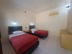 Postel nebo postele na pokoji v ubytování Lovina Beach Hotel