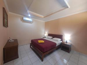 Postel nebo postele na pokoji v ubytování Lovina Beach Hotel