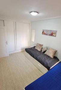 Posteľ alebo postele v izbe v ubytovaní Apartament z dużym tarasem na pięknym osiedlu