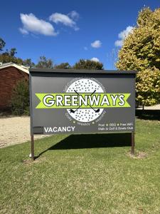 a sign for a greenways sign in the grass at Greenways Holiday Units in Tocumwal