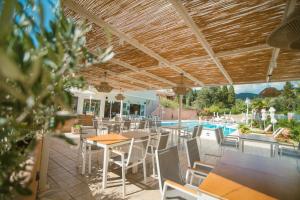 The swimming pool at or close to Dominoes Corfu