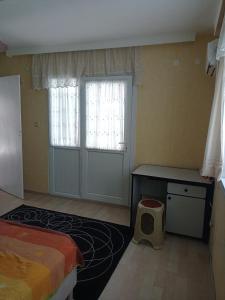a bedroom with a bed and a desk and a window at ESKA 121 airport in Dalaman