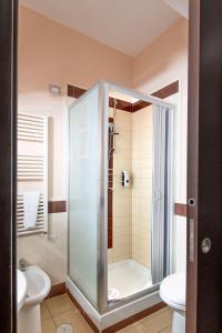 a bathroom with a shower with a toilet and a sink at B&B Studio83 Pompei in Pompei +111 photos