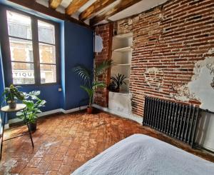 Posteľ alebo postele v izbe v ubytovaní Ancien hôtel particulier avec patio