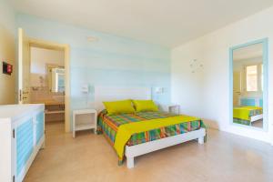 Кровать или кровати в номере Cava Li Santi Residence
