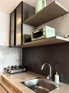 Kuchyň nebo kuchyňský kout v ubytování R20 Apartment Daymentroom 2BR 0620 + 2 fotografie