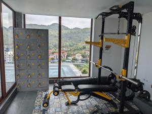 a room with a gym with a simulator at Eden Hotel Cát Bà in Cat Ba