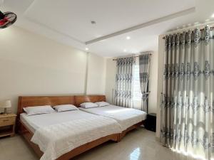 En eller flere senge i et værelse på Motel Phương Thảo Phong Tập Thể + 23 billeder