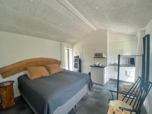 Postel nebo postele na pokoji v ubytování Tiny Guesthouse