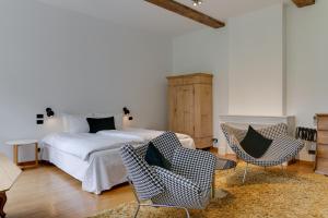 Un ou plusieurs lits dans un hébergement de l'établissement Small Luxury Hotel De Witte Lelie