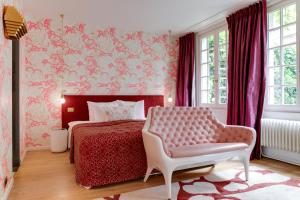 Un ou plusieurs lits dans un hébergement de l'établissement Small Luxury Hotel De Witte Lelie