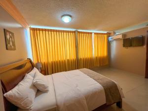 Postel nebo postele na pokoji v ubytování Apart Hotel Hamilton