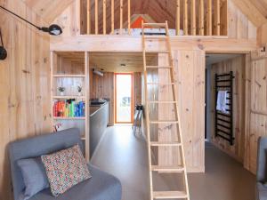 a loft bed in a tiny house at North Light Studio in Carinish