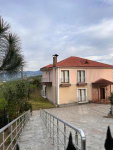 a house with a fence in front of it at Özyurt Villa in Araklı