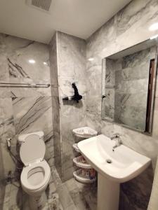 a bathroom with a toilet and a sink at Heavenly place 777 on Mai Khao in Ban Mai Salae +12 photos