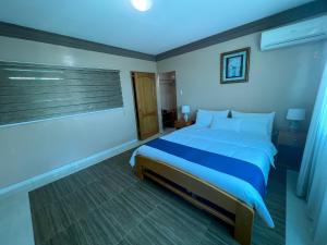 Postel nebo postele na pokoji v ubytování Apart Hotel Hamilton
