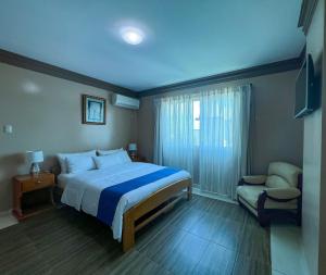 Postel nebo postele na pokoji v ubytování Apart Hotel Hamilton