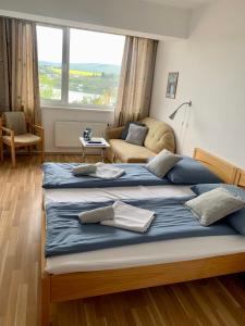 Llit o llits en una habitació de Penzion Kozí Horka u Brněnské přehrady