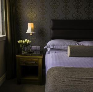 Giường trong phòng chung tại International Hotel Killarney