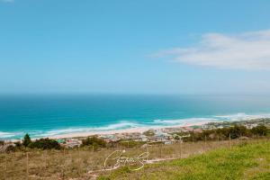 a view of the ocean from the top of a hill at Oppi Plaas See Uitsig Seemeeu in Great Brak River