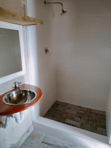 a bathroom with a sink and a window at Oppi Plaas See Uitsig in Groot Brak Rivier