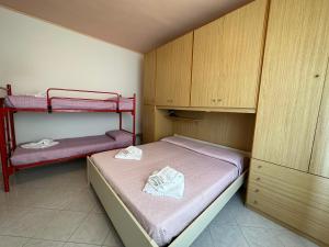 Postel nebo postele na pokoji v ubytování Affittacamere I Gigli di Mare