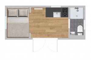 a floor plan of a small bedroom with a bed at The Nutbourne Hut - shepherd's hut - pint-sized luxury in Hambrook