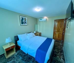 Postel nebo postele na pokoji v ubytování Apart Hotel Hamilton