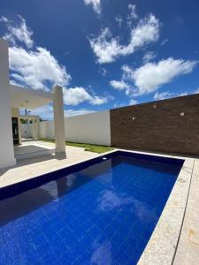 a swimming pool in the backyard of a house at Casa Nova Triunfo in Triunfo