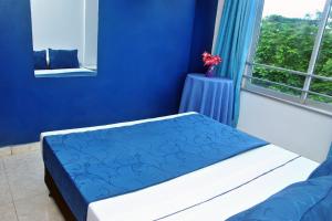 Postel nebo postele na pokoji v ubytování Ayenda Hotel Roisa