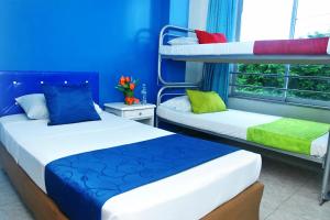 Postel nebo postele na pokoji v ubytování Ayenda Hotel Roisa