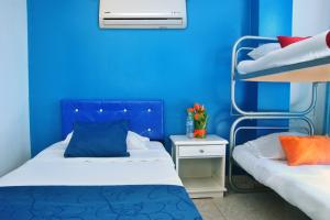 Postel nebo postele na pokoji v ubytování Ayenda Hotel Roisa