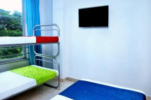 Postel nebo postele na pokoji v ubytování Ayenda Hotel Roisa
