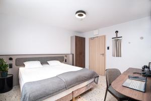 Postel nebo postele na pokoji v ubytování Antares Hotel