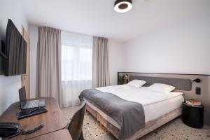 TV a/nebo společenská místnost v ubytování Antares Hotel
