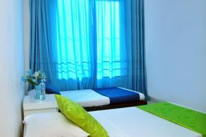 Postel nebo postele na pokoji v ubytování Ayenda Hotel Roisa