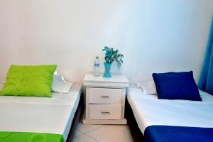 Postel nebo postele na pokoji v ubytování Ayenda Hotel Roisa