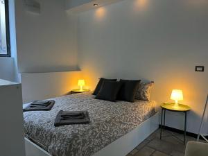 Postel nebo postele na pokoji v ubytování Loft Matteotti - Studio in centro