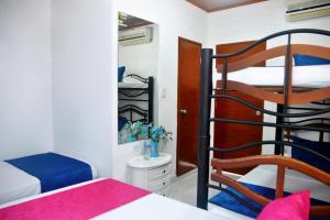 Postel nebo postele na pokoji v ubytování Ayenda Hotel Roisa