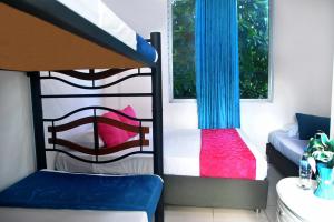 Postel nebo postele na pokoji v ubytování Ayenda Hotel Roisa